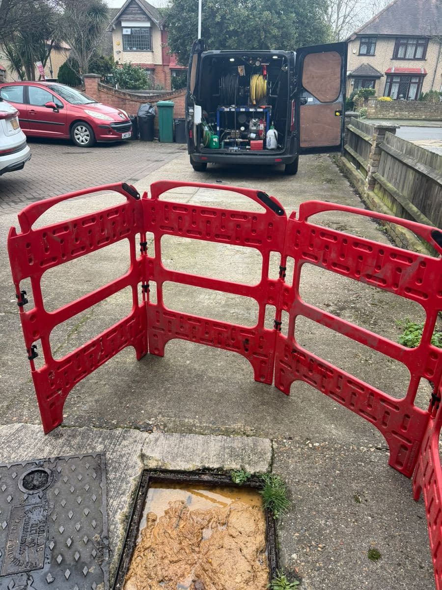 AllTime Drainage van with safety barriers around an open drain